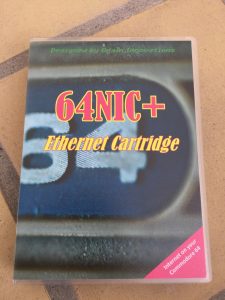 64 NIC+ ethernet network cartridge using RR-net, NET-64 or the TFE system. The cartridge has been placed in a Universal Game Case.
