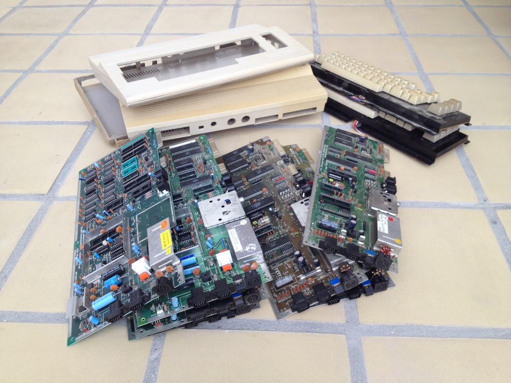 Stack of broken Commodore 64 motherboards and cases, assy 250469, assy 250407 anf Assy 250425