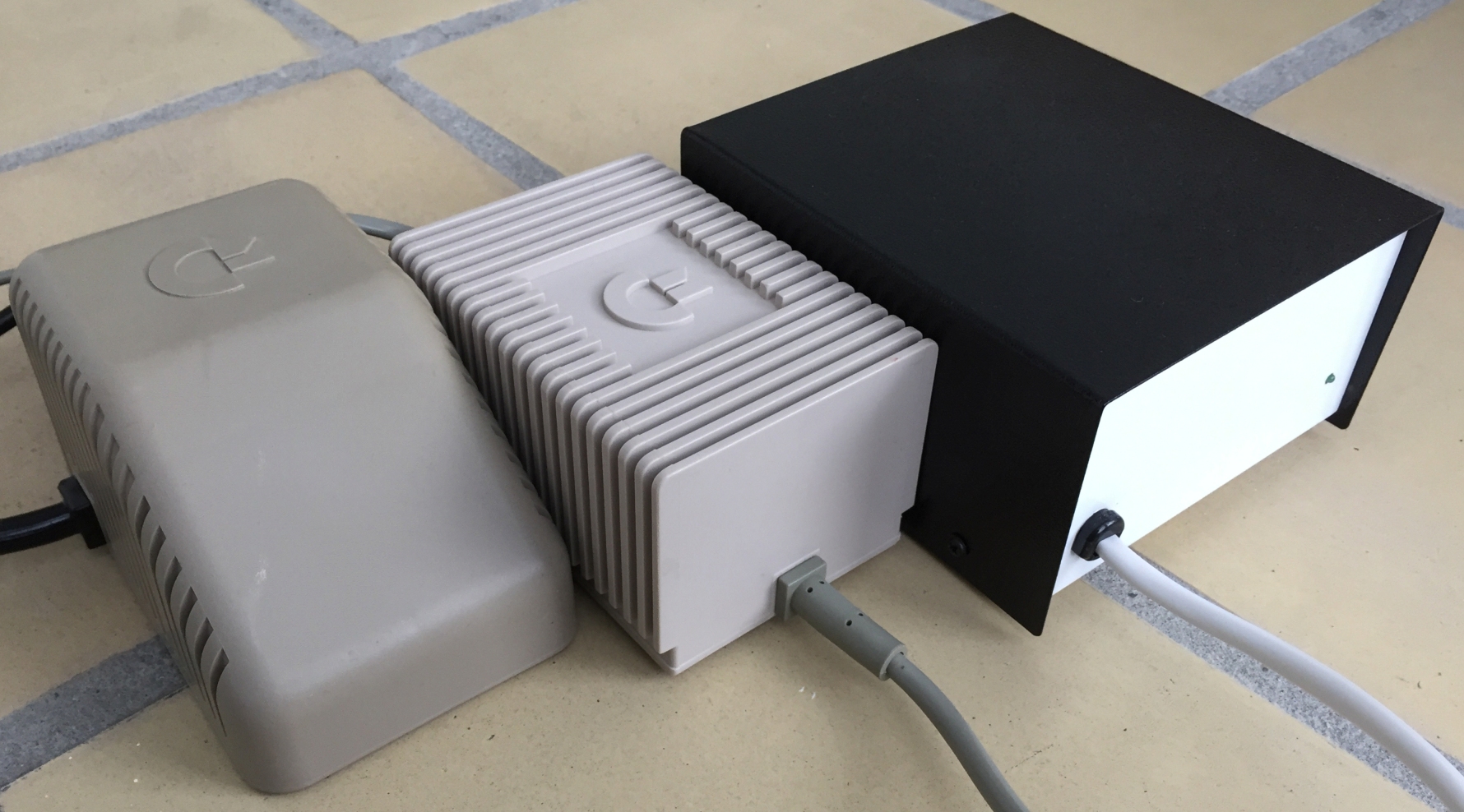 Commodore 64 power supplies including Part No. 902503-06, Part No. 902503-11, Part No. 251053-11, Ray Carlsen PSU and Ray Carlsen Computer Saver