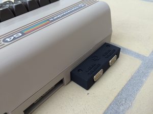 Commodore 64 4 player adapter. Read more on breadbox64.com