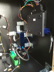 The modded ATX power supply unit mounted in the arcade machine. 
