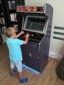 Nephew playing Metal Slug on the Metal Slug arcade.
