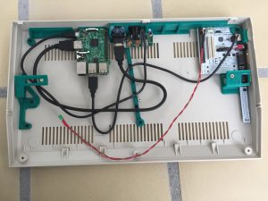 Commodore 64 modded with a Raspberry Pi 3 model B. The machine runs RetroPie with emulators for the Commodore 64. Read about the mod on breadbox64.com.