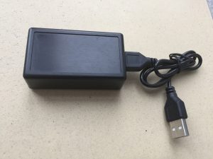 USB adapter for Commodore joysticks with blue LED logo. breadbox64.com